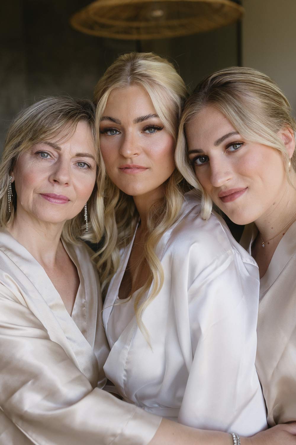 Portrait of the bride, her mother, and sister exuding beauty.