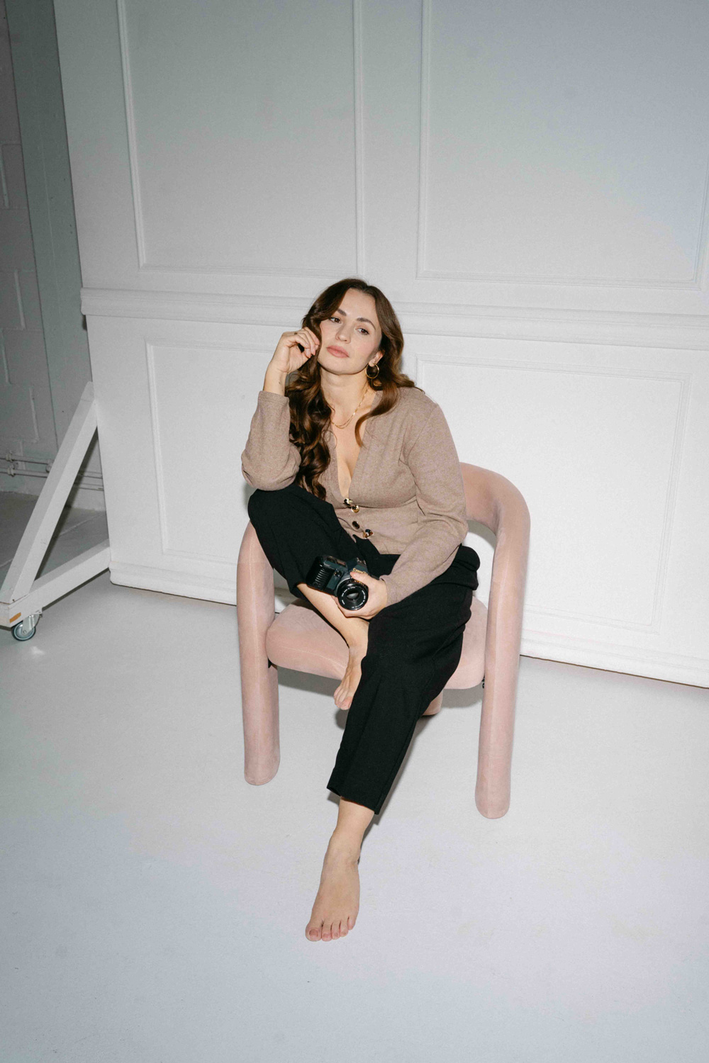 Couple posing on Westminster Bridge in a black-and-white editorial style.